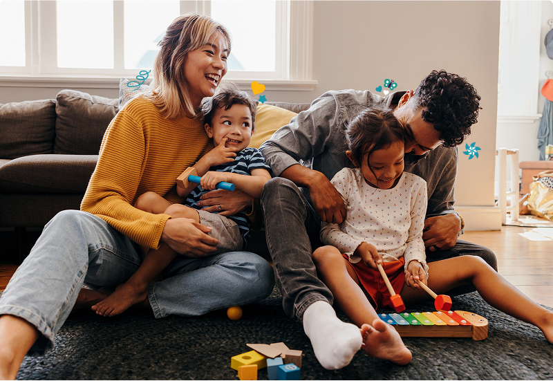 Mom and dad playing with their kids